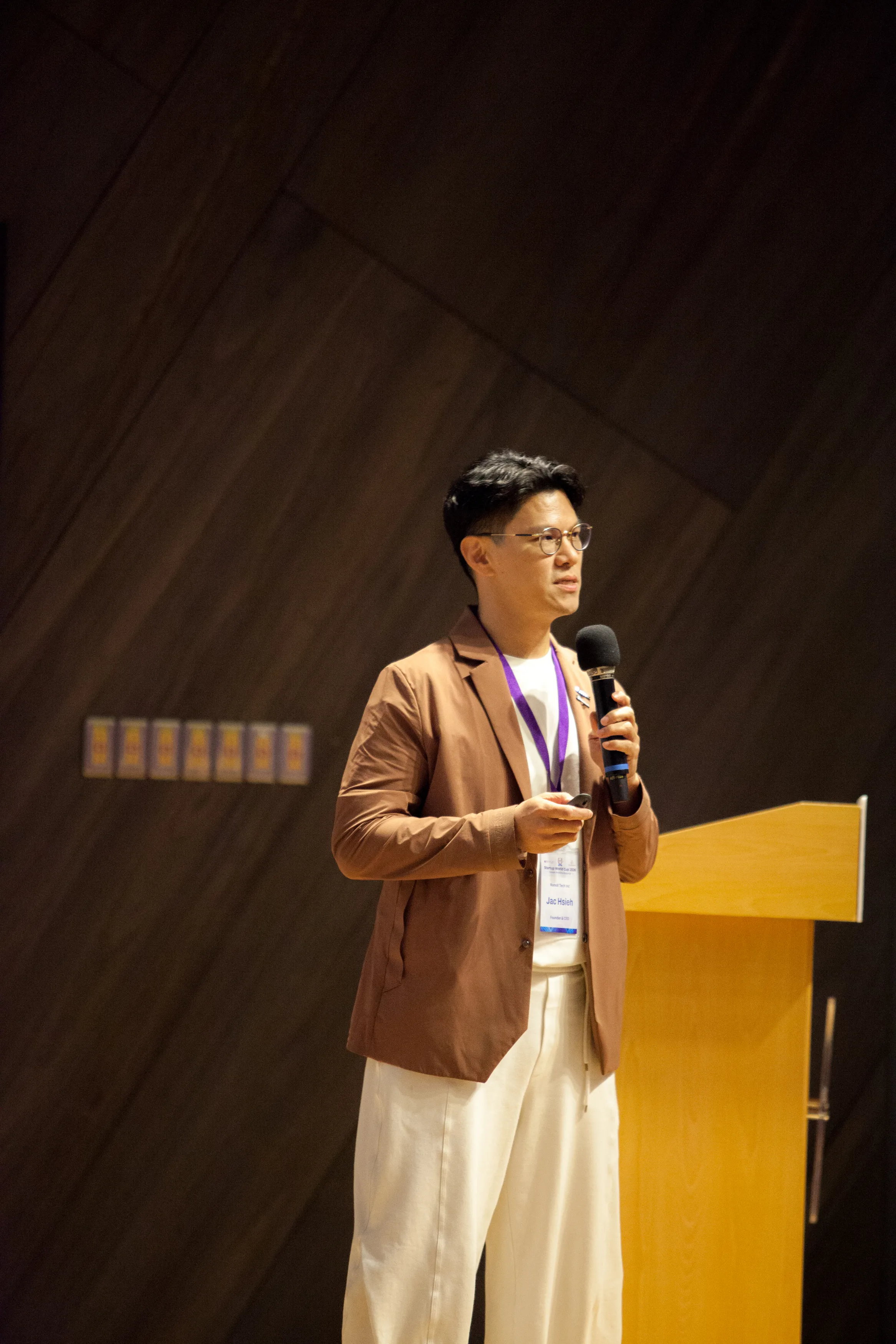 NunoX Founder Jac Hsieh pitching on stage at Startup World Cup Taiwan Hsinchu 2026.