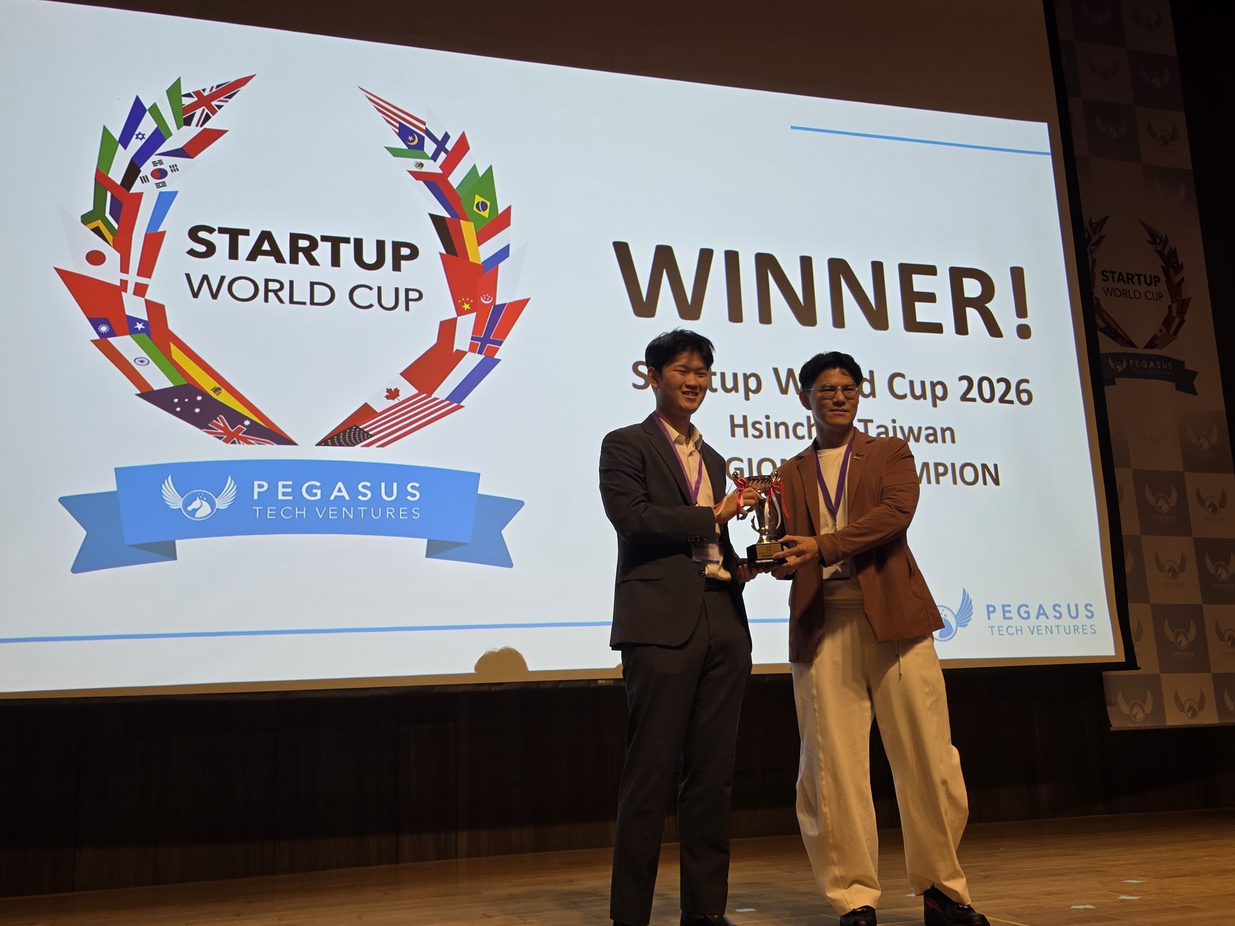NunoX receiving the Startup World Cup Taiwan Hsinchu 2026 Regional Champion trophy.